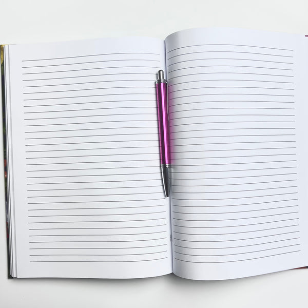 Open journal that shows lined pages. On the middle it has a pink pen to helo compare sizes.